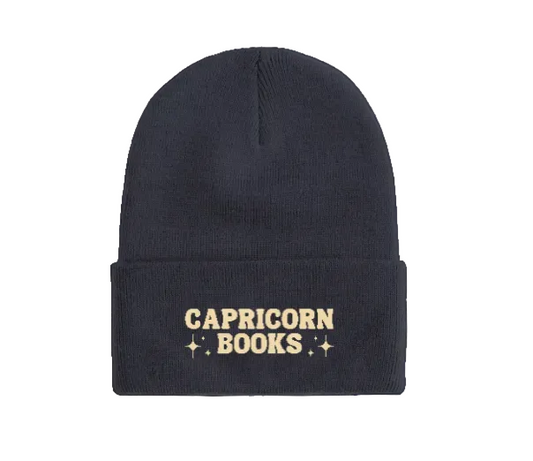 Navy beanie with 'Capricorn Books' text in tan